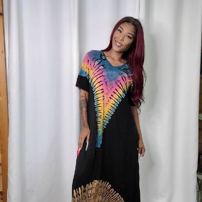 She has a red dyed hair with long colorful nails